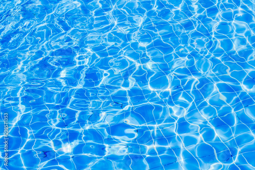 Surface of blue water wave in swimming pool  Pool water background.