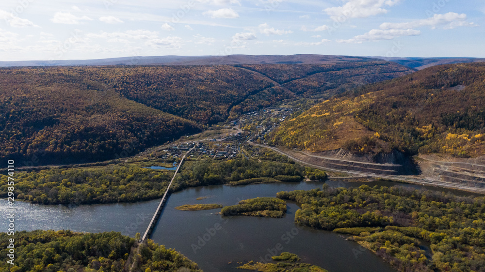 Obraz premium bridge over the river top view. mountain river.