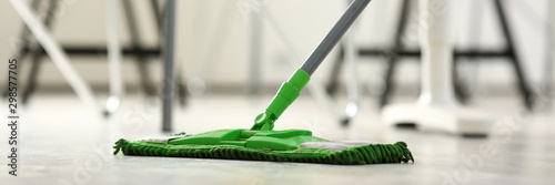 Green plastic mop photo