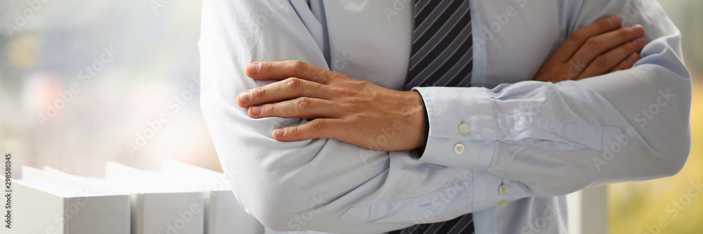 Obraz premium Male hands in suit crossed on chest closeup background