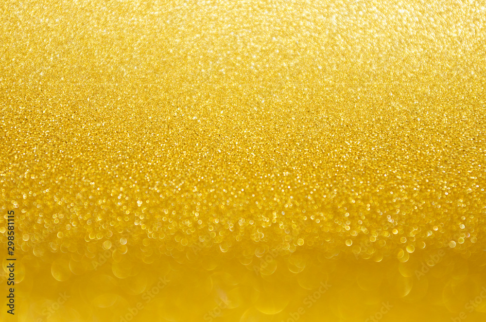 Golden glittering glowing bokeh background with blur band. Golden glittering glowing bokeh background with blur band.