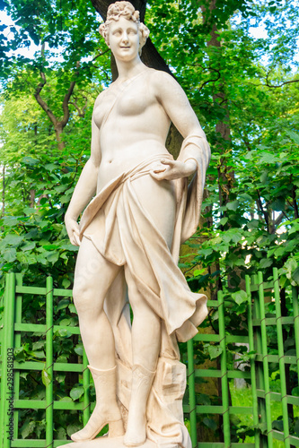 Bild auf Leinwand Marble statue of muse of comedy and light poetry Thalia in old city park Summer Garden in St
