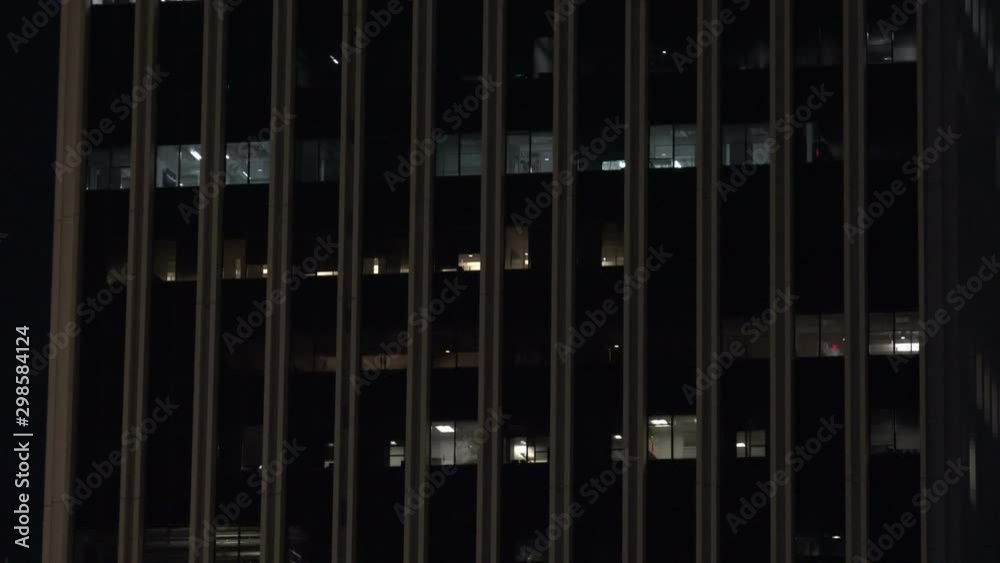 Establishing shot of light coming from windows in a tall skyscraper at night Establishing shot of light coming from windows in a tall skyscraper at night