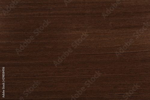 Excellent dark brown venge veneer background as part of your strict style. High quality wood texture.