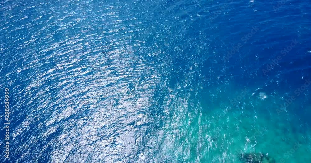 Clear Bright Blue Waters in Bermuda Triangle - Shipwreck and Rock Territory - Aerial Shot 4K