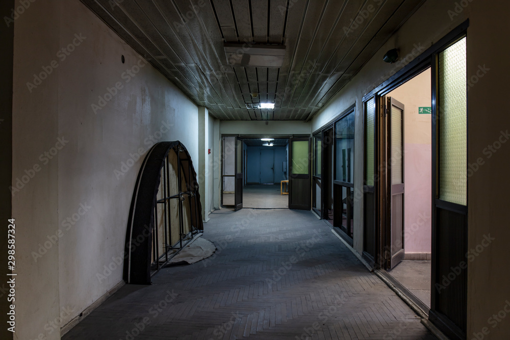 Long dark corridor in an old industrial building