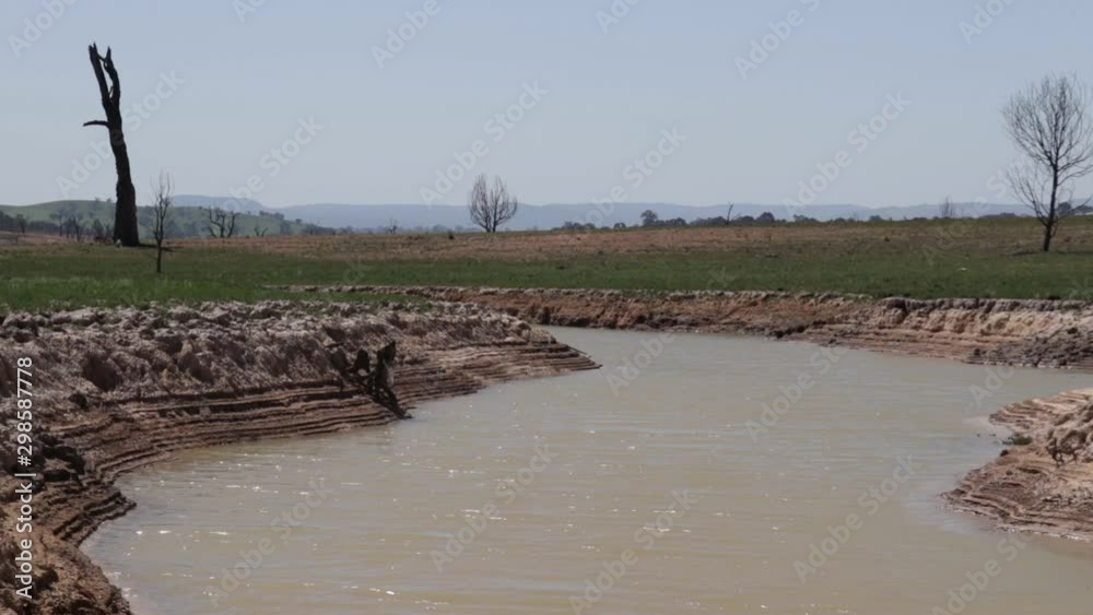 Visible fresh water lake stream bed with exposed waterline, low water, lock down shot. Visible fresh water lake stream bed with exposed waterline, low water, lock down shot.
