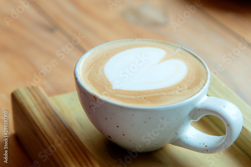 woman is drinking art latte coffee