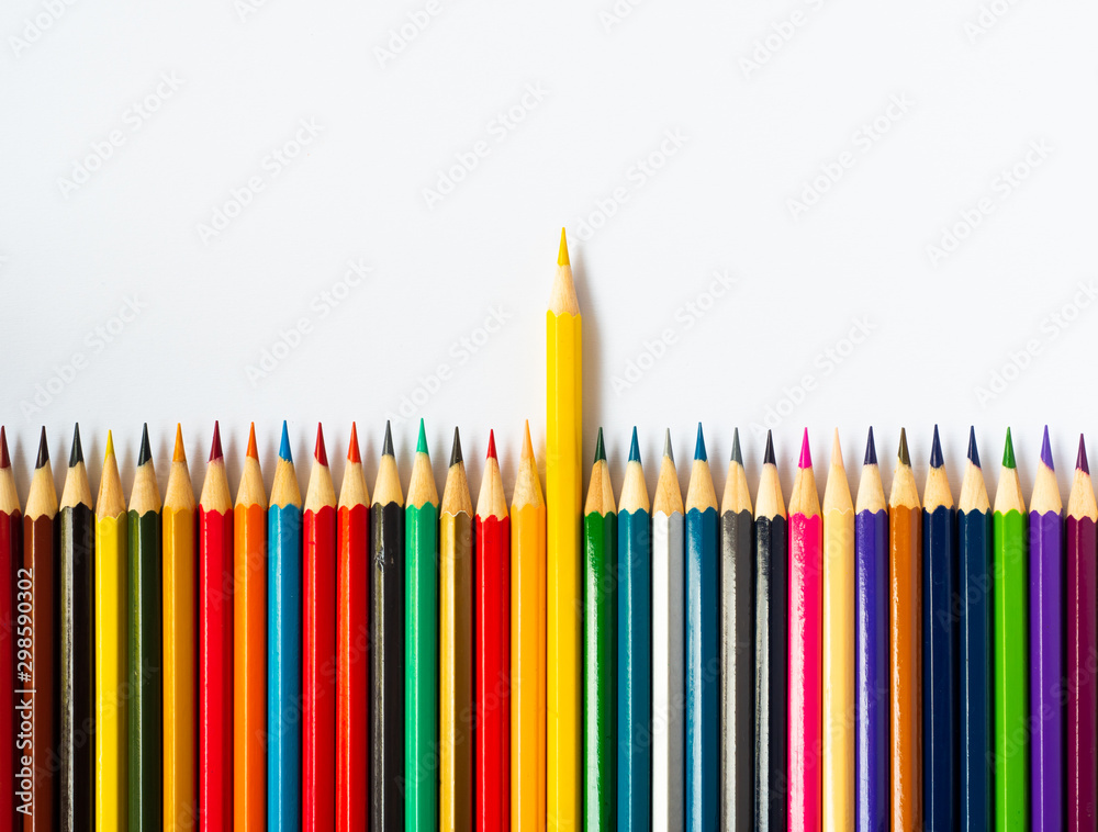 Colored pencils on white wooden background, Stationery Concept. Top view with copy space.