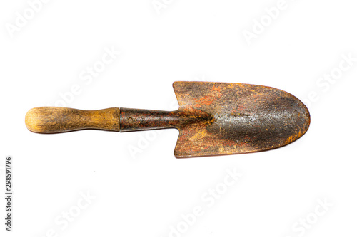 Vintage garden trowel isolated on white background, worn old garden hand tool.