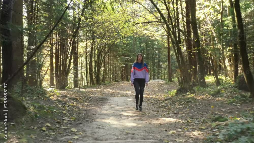 Ukraine. Young girl walking in the wild forest Ukraine. Young girl walking in the wild forest