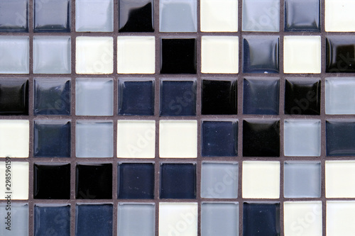 Mosaic Background of Black, White And Gray Ceramic Tiles.