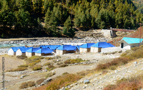 Landscape view of Baspa River Camp area in Chitkul - last village on Indo-Tibetan border. The finest adventure camp in India with Baspa River is on one side and Himalayan mountain on other side photo