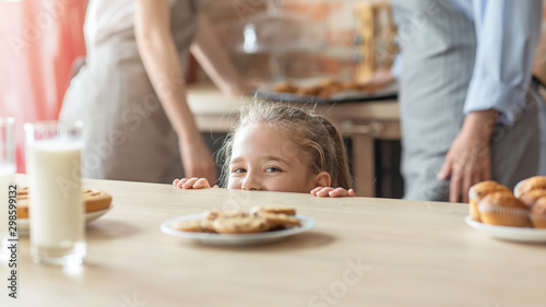 Naughty little girl going to get some cookies