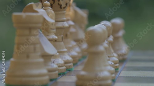 Full chess board. Close up of figurines on Chessboard outside