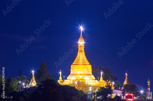 Golden pagoda  Burmese style art with lights at dawn in Sagaing city  Myanmar.