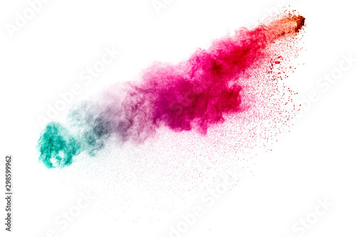 Colorful powder explosion on white background. Abstract pastel color dust particles splash.