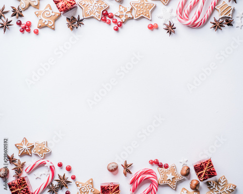 Christmas composition, New Year greeting card. Mockup with festive food decorations and gingerbread cookies on white background. Copy space