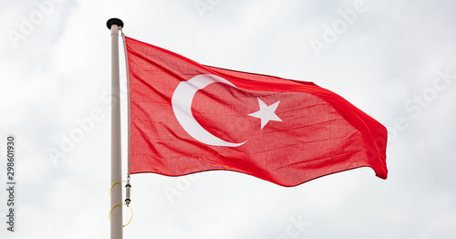 Quadro su tela Turkish flag waving against cloudy sky background
