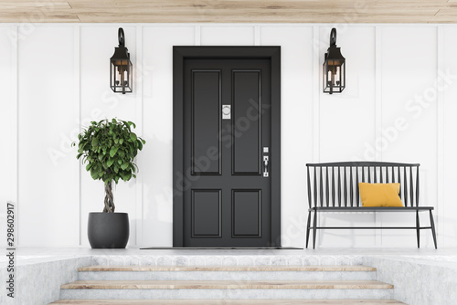 Canvas Print Black front door of white house, tree and bench