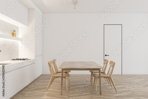 White kitchen with wooden table