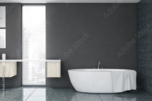 Gray bathroom with tub and shelves