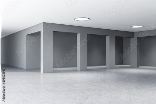Empty concrete office building hall with columns
