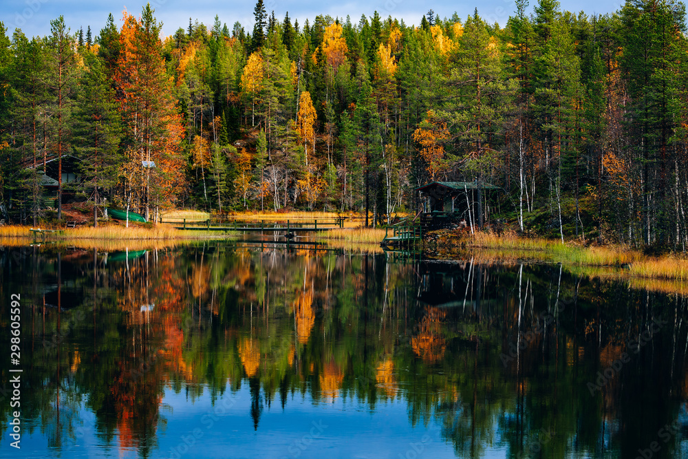 Autumn landscape. Fall colors reflection in lake in Finland Autumn landscape. Fall colors reflection in lake in Finland