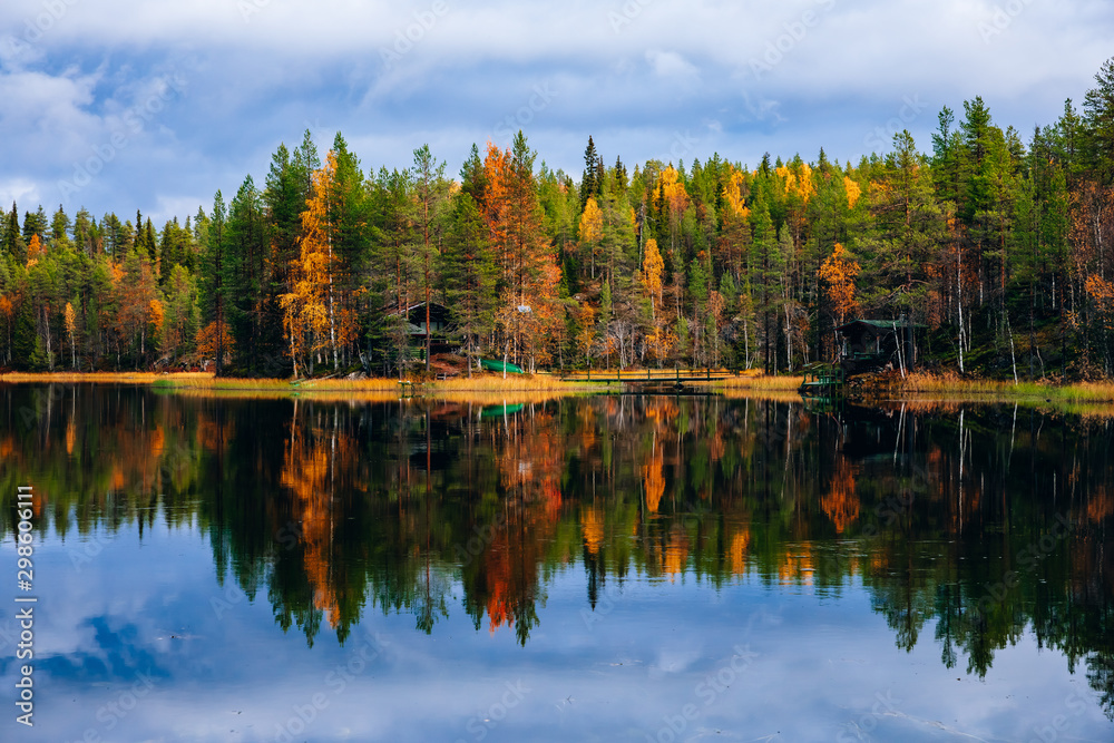 Autumn landscape. Fall colors reflection in lake in Finland Autumn landscape. Fall colors reflection in lake in Finland