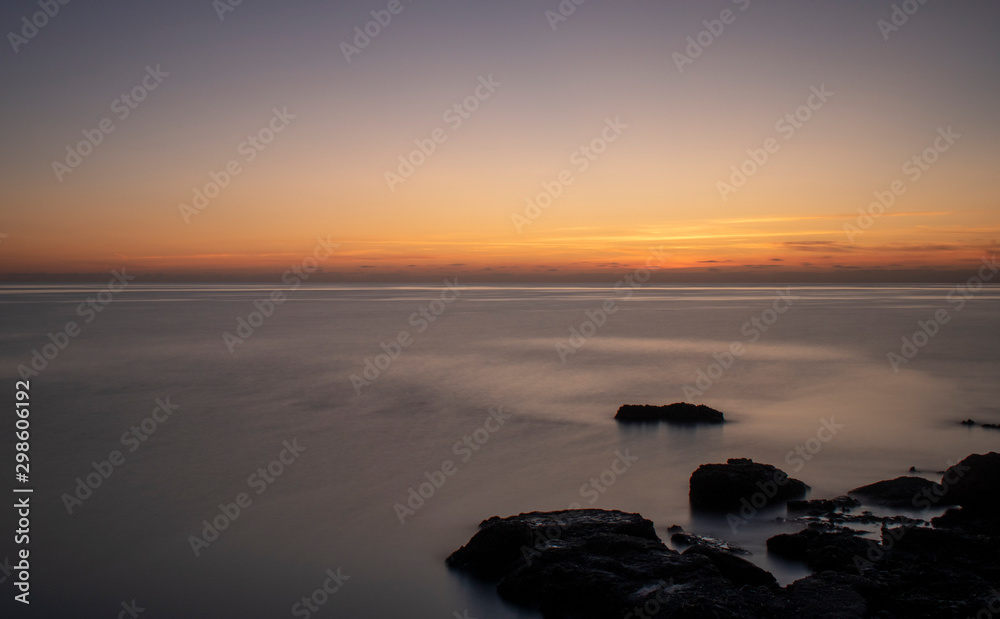 Pre Sunrise near Cala Bona Mallorca with a flat sea giving a surreal feel to the early morning.