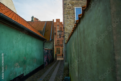 Helsingor, Denmark: Beautiful graffiti on the wall. Street view with colorful buildings in Elsinore, Denmark. photo