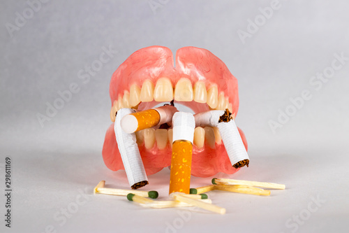 False jaw and broken cigarettes.