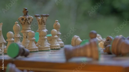Slow motion Angry hitting the chessboard. Chess pieces are flying in the air. side view