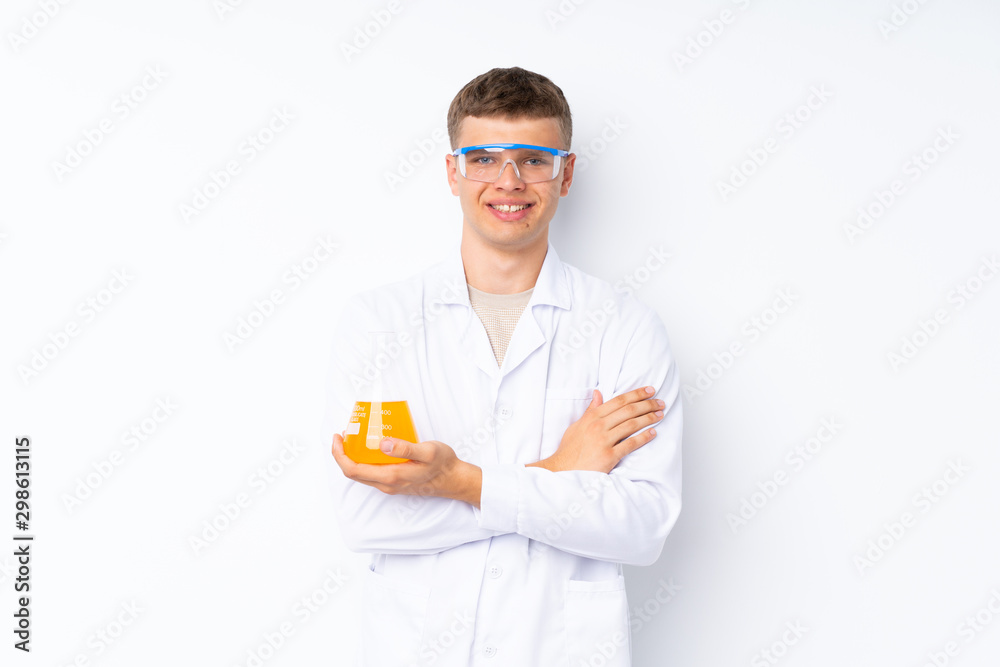 Young handsome man over isolated white background with a scientific test tube Young handsome man over isolated white background with a scientific test tube