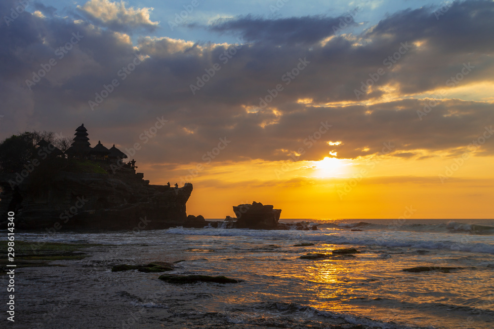 Tanah Lot in golden sunset, Bali, Indonesia.