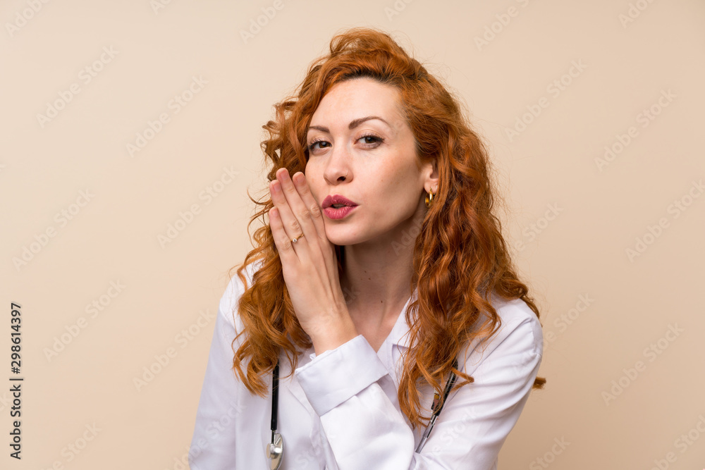 Redhead doctor woman whispering something Redhead doctor woman whispering something