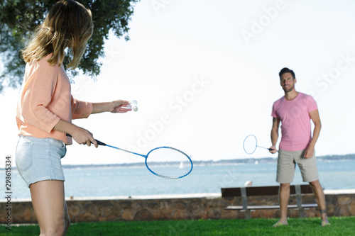 a couple with badminton rackets