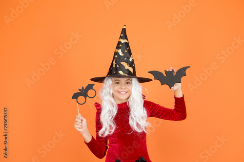 Curse spell. Little girl cast magic spell orange background. Wicked witch spell. Magic and witchcraft with spell and incantation. Holiday celebration. Halloween party fun. Witchery. Magical skills © be free