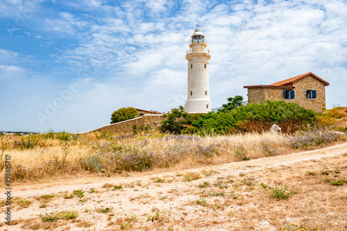 Republic of Cyprus. Pathos. Lighthouse on the coast. Archaeological park. Paphos archaelogical site. Lighthouse on the shores of the Mediterranean Sea. Walks in Cyprus. House Near Lighthouse