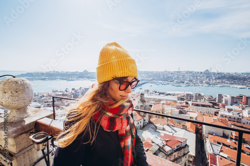 Canvas Print Young smiling girl on the background of the panorama of Istanbul on sunny spring day