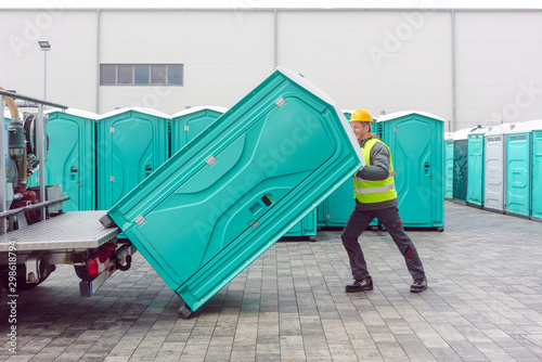 Rental lavatory being loaded on truck
