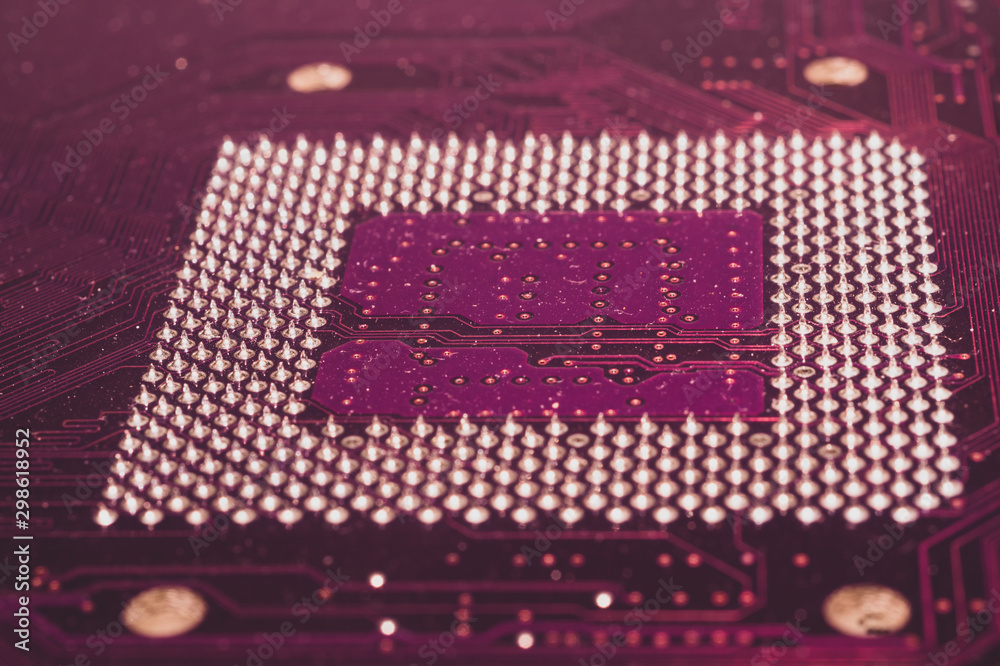 Processor pins macro. computer motherboard close up. cpu pins on a circuit board. computer central processor unit. modern technologies abstract background Processor pins macro. computer motherboard close up. cpu pins on a circuit board. computer central processor unit. modern technologies abstract background