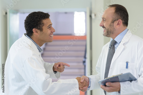 happy doctors doing a handshake