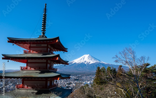 The iconic view of Mount Fuji with the red Chureito pagoda and Fujiyoshida city from Arakurayama sengen park in Yamanashi Prefecture  Japan.