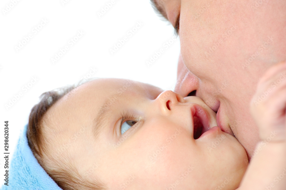 Close-up a caring young mother wipes girl Close-up a caring young mother wipes girl