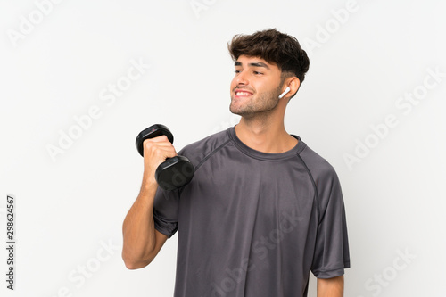 Sport man over isolated white wall looking side