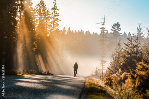 man walking in the forest