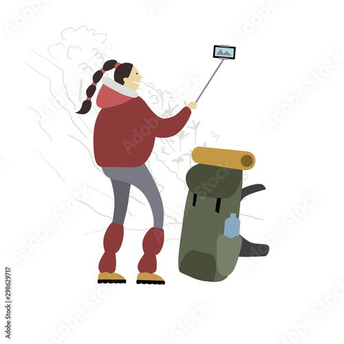 Hiker with backpack takes selfie in mountains.
