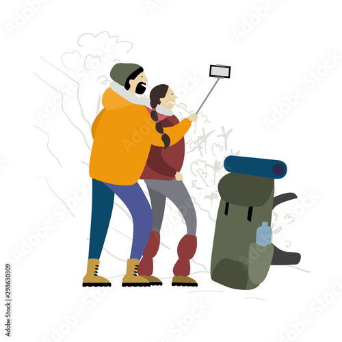 Couple of Hikers with backpacks takes selfie in mountains