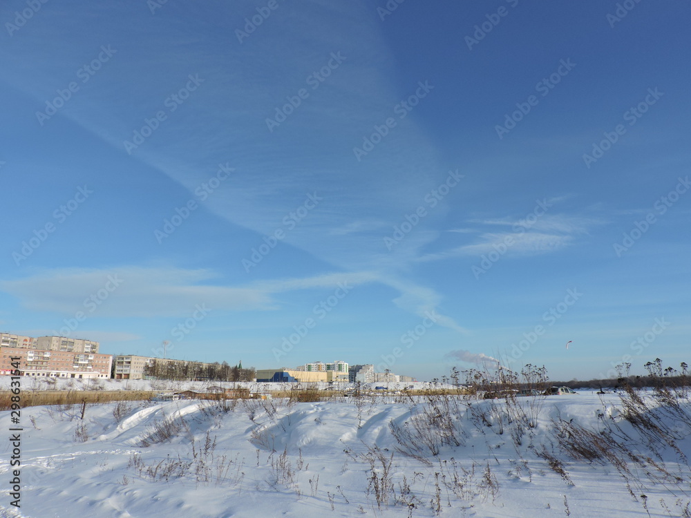 winter landscape with river and blue sky